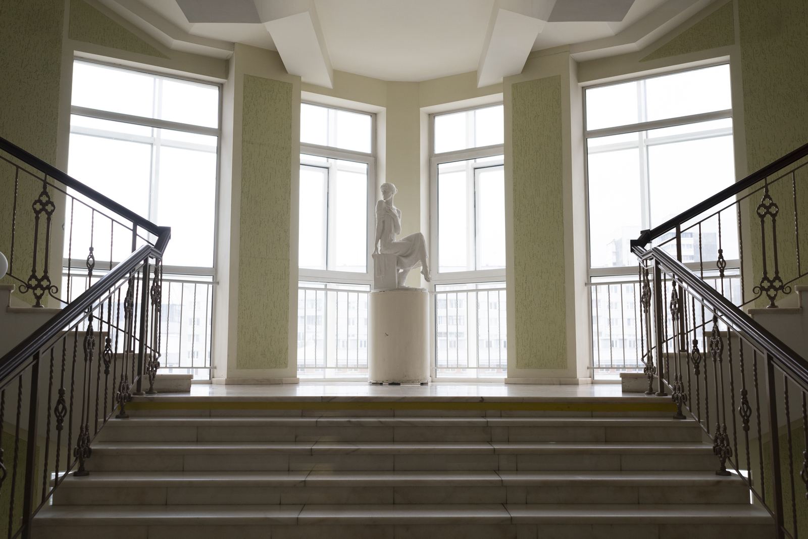 Classical staircase interior with statue